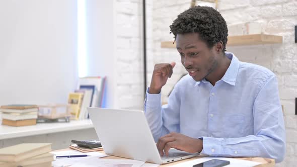 Video Chat on Laptop By African Man