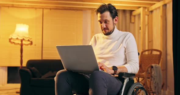 Smiling Bearded Disabled Handicapped Man Using Laptop Indoors Millennial Businessman Mobile