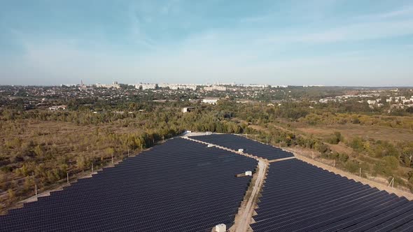 Solar energy farm. High angle, elevated view of solar panels on an energy farm far from city