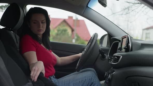 A European Girl Stops the Car After the Trip and Gets Out of It