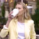 Woman Drinking Coffee in Urban City Cafe - VideoHive Item for Sale