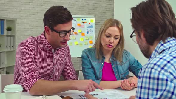 Coworkers Discussing Business in Office