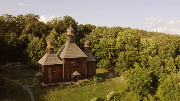 Traditional Wooden Church in a Forest alt
