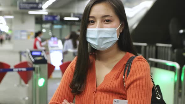Young asian woman cover mouth , wear medical face mask to protect viruses