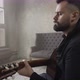 Young Man Playing Guitar in the Room - VideoHive Item for Sale
