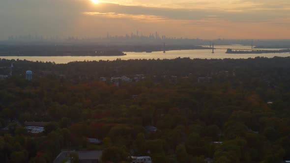 Rising Aerial of New York City Skyline at Sunset Seen from Long Island