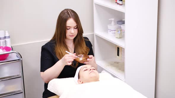 Beautician Doctor Making Skincare Procedure in Beauty Salon Portrait of Girl Closeup