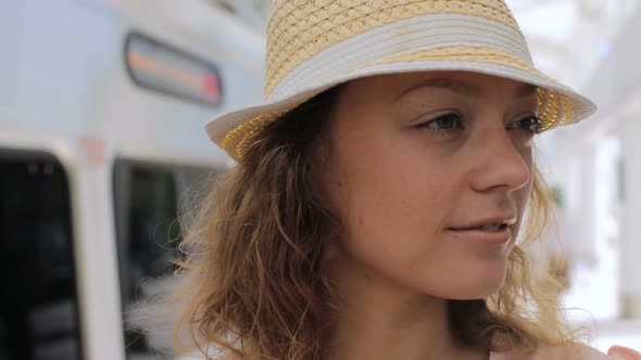 Young woman traveling by train in the Summer.