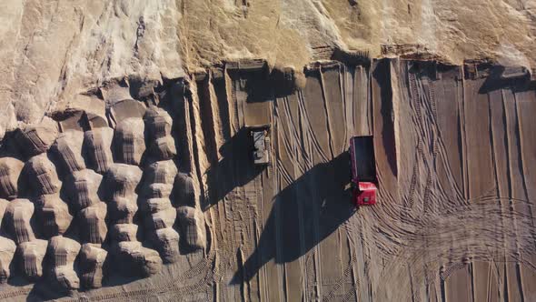 Aerial top down view of leveling ground with a bulldozer.