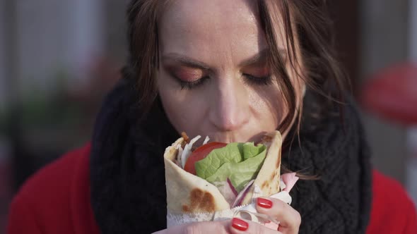 Young Girl Eats Shaurma Gyros Closeup