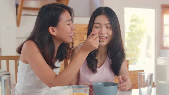 Asian Lesbian lgbtq women couple have breakfast at home.