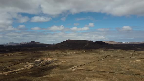 Barren and arid nature landscape on the island of Lanzarote with volcanic mountains