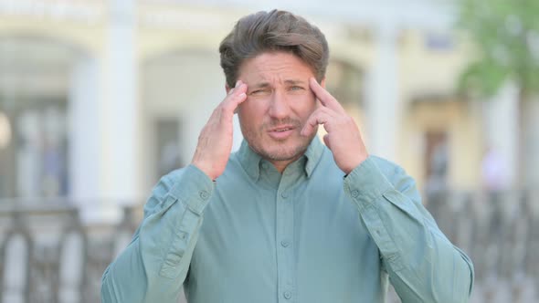 Tense Man having Headache