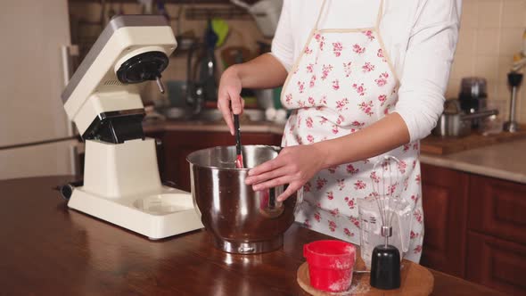 Woman Is Stirring Dough in the Bowl