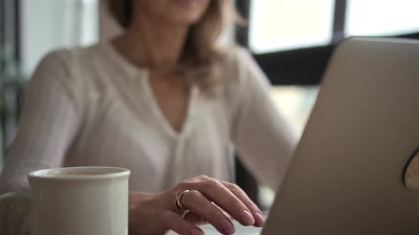 Mature Business Woman Using Laptop Computer at Workplace Office