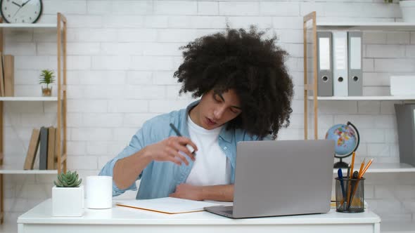 Student Learning At Laptop Yawning Tired Of Exam Preparation Indoor