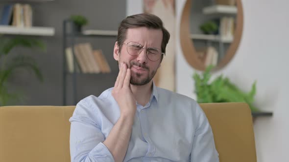 Portrait of Young Man Having Toothache Cavity