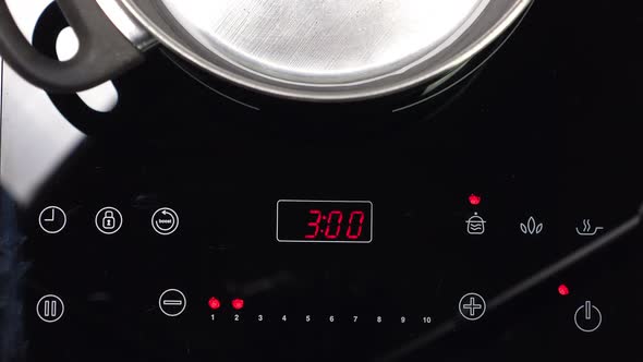 Switch on Induction Stove and Set Power of Heating