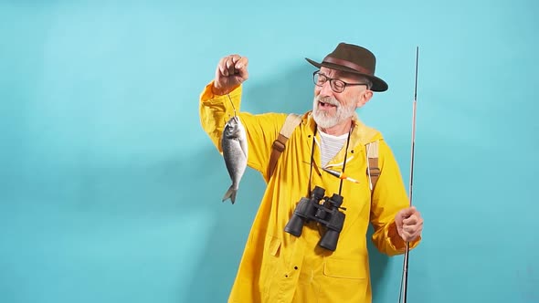 Smiling Funny Old Fisherman Has Caught Fish for His Wife, Family