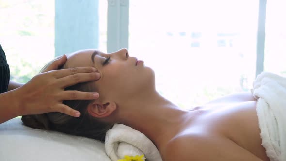 Woman Gets Facial and Head Massage in Luxury Spa