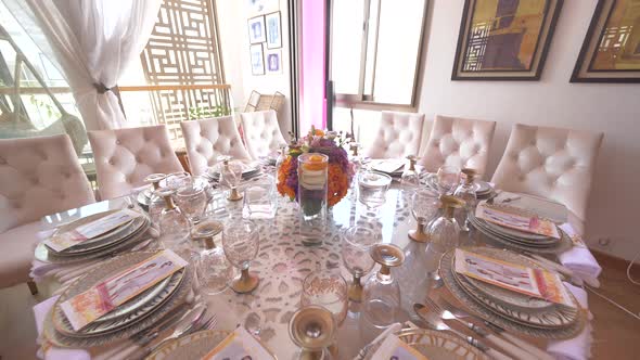 Backward movement shot of a luxurious dining table in the dining room. Wedding reception table decor