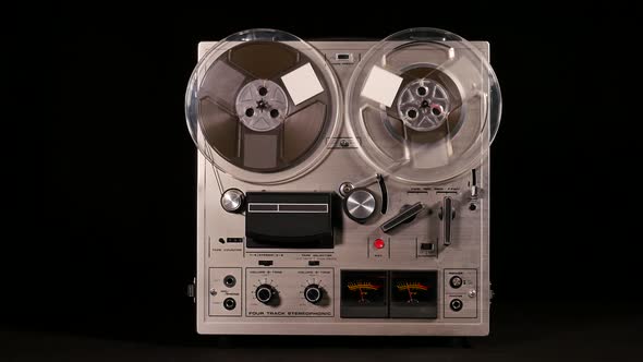 Vintage Reel to Reel tape recorder playing music