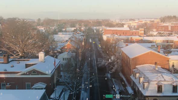 AERIAL Over Rooftops Of Downtown Lititz, Pennsylvania USA During Snowstorm