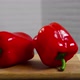 Bell pepper falls on a bamboo cutting board - VideoHive Item for Sale