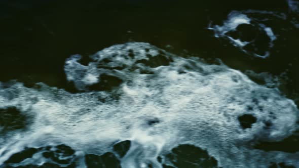 Water And Waves Of Passing Ferry