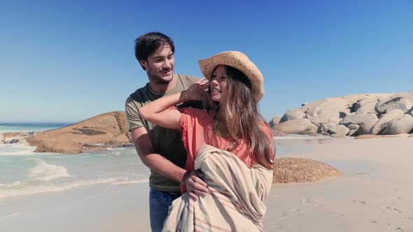 Couple embracing on beach