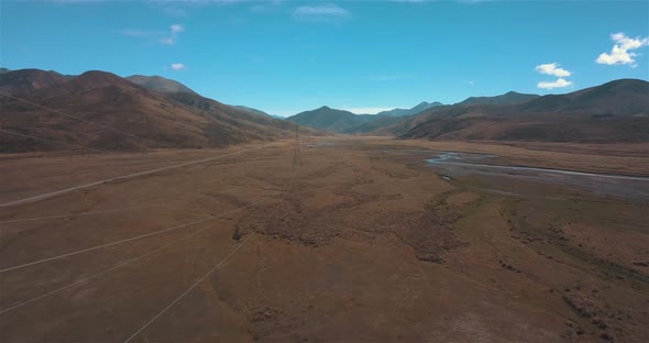 Drone Flying Alongside Power Lines Next to Clarence River New Zealand