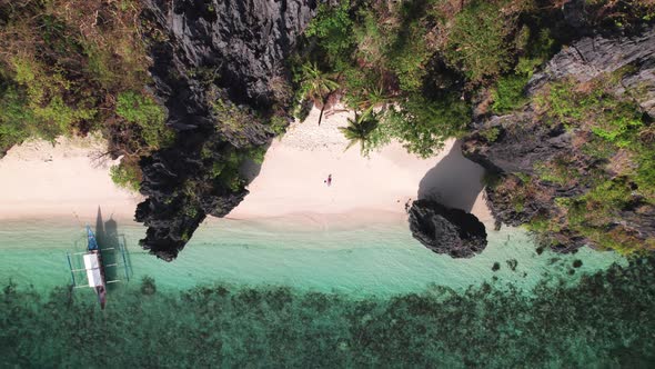 Drone Of Woman Sunbathing In Swimsuit On Entalula Beach