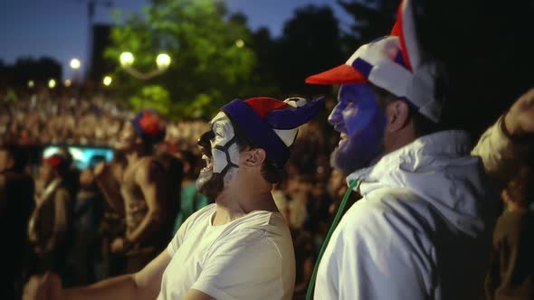 Friends with Paint on Face in Delight Victory of Socer or Football Match Slow Mo