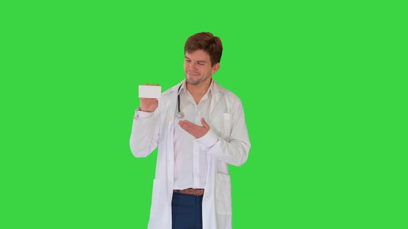 Smiling Male Doctor with Stethoscope Walking and Advertising Pills on a Green Screen Chroma Key