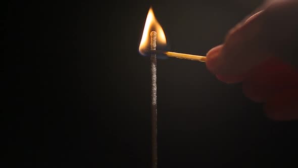 Human Hand Lighting Bengal Fire With Burning Match, Bright Flare Sparkling