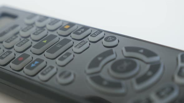 Pressing of PLAY button on multimedia remote control close-up footage