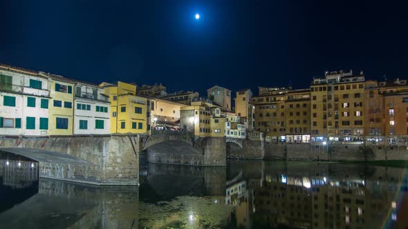 Famous Ponte Vecchio Bridge Timelapse Hyperlapse Over the Arno River in Florence, Italy, Lit Up at