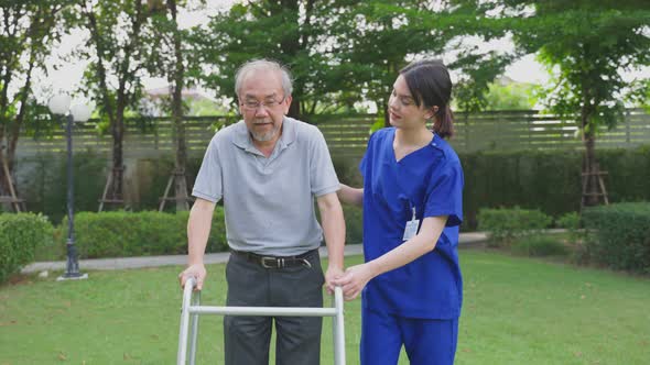 Caregiver doctor serve physical therapy for older patient to exercise and practice walk in park.