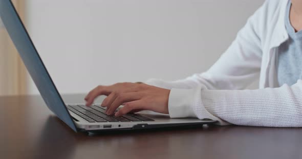 Woman work on laptop computer at home