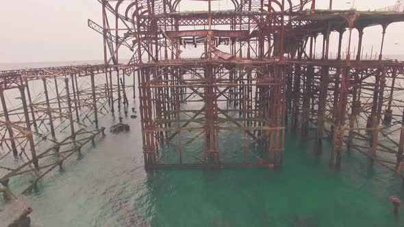Burnt old West Pier in Brighton, Sussex, England. Aerial drone view