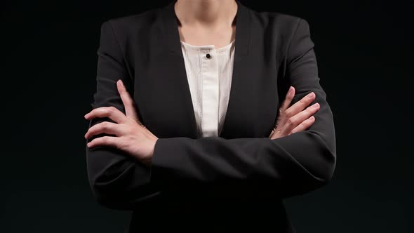 woman folds her arms over her chest and makes other different gestures