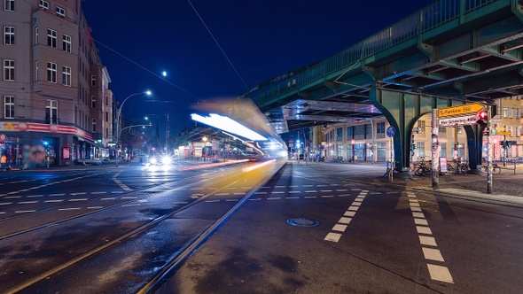 Night Time Lapse of Eberswalder Strasse with subway trams and cars Berlin, Germany