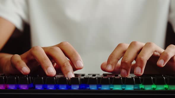 African American Man Gamer Using Backlight Keyboard Closeup Guy Playing Video Game