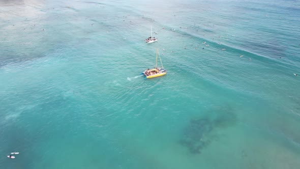 A sunset cruise boat picks up couples looking to enjoy a night on the ocean eating diner and drinkin