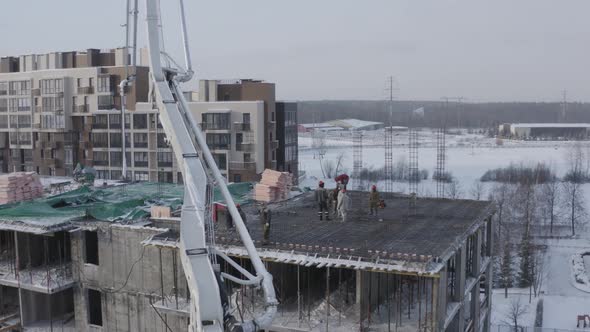 A Drone View of the Construction of a Residential Building Using a Concrete Pump