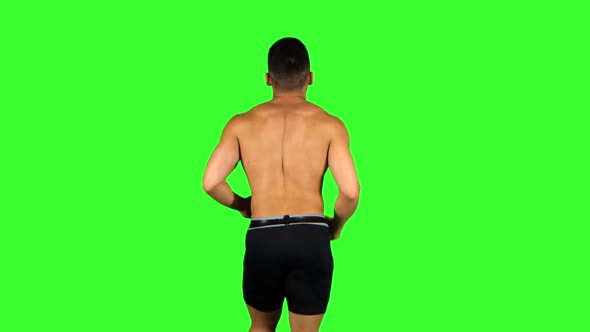 Man Run on Green Screen Background. Back View