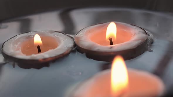 Candles floating in water