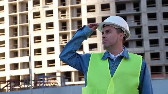 Worker Staff or Engineer in White Protective Helmet at Construction Site