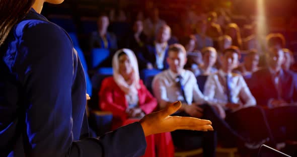 Businesswoman speaking in business seminar at auditorium 4k