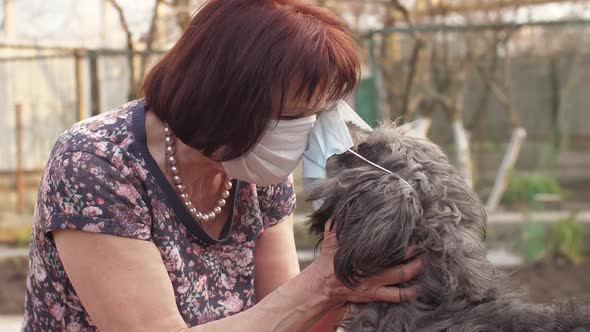 Coronavirus Concept. Dog with Mistress in Masks.